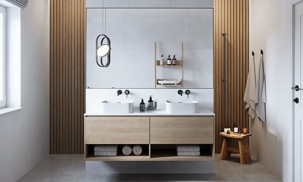 Ein helles Badezimmer mit Doppelwaschbecken, Holzelementen und moderner Beleuchtung zeigt den Badezimmertrend der Natürlichkeit und Funktionalität.