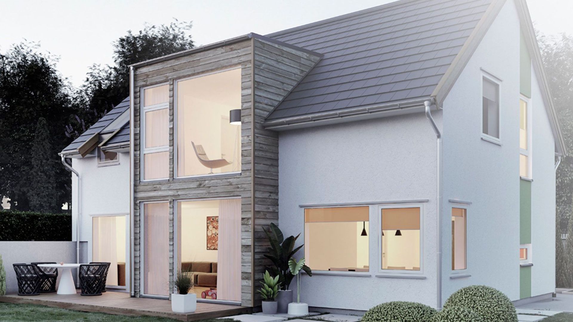 Outside view of a white smart home house with lights on on the inside